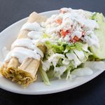A tamal verde with a side salad at City Tamale in Hunts Point. <br />